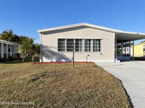 606 Dolphin Cir, Barefoot Bay, FL 32976