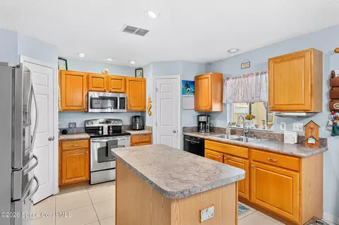 Kitchen - 256 Mcclain Dr, Melbourne, FL 32904 photo 1 of 4