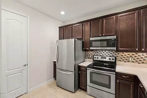 Kitchen - 5748 Tamarac Dr, Melbourne, FL 32940 photo 2 of 3