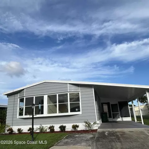 911 Hyacinth Cir, Barefoot Bay, FL 32976