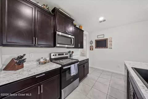 Kitchen - 3250 Burrowing Owl Dr, Mims, FL 32754 photo 3 of 3