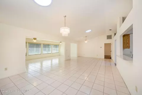 Living - 1527 Frontier Dr, Melbourne, FL 32940 photo 2 of 11