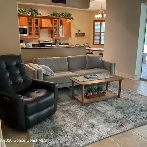 Living - 3933 Postridge Trl, Melbourne, FL 32934 photo 4 of 6