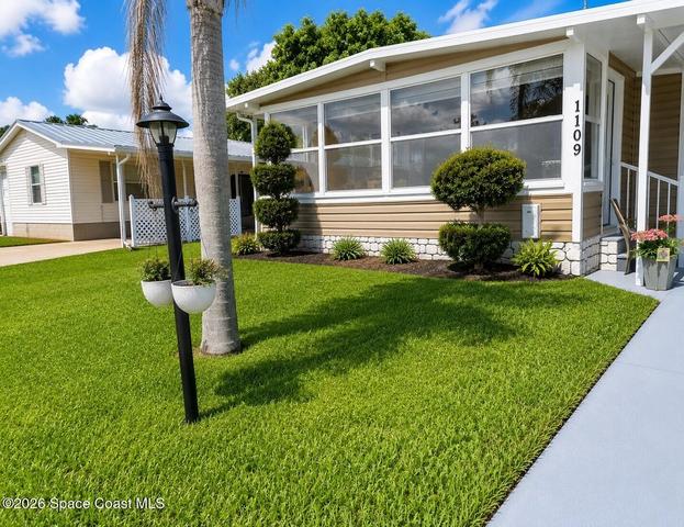 1109 Wren Cir E, Barefoot Bay, FL 32976