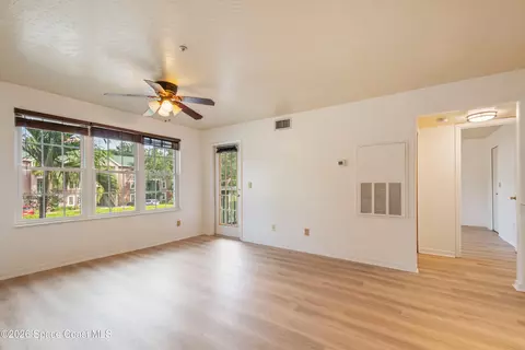 Living - 7667 N Wickham Rd #813, Melbourne, FL 32940 photo 1 of 8