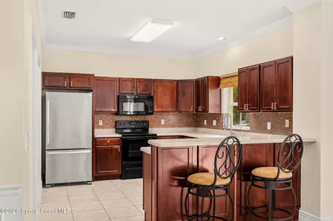 Kitchen - 622 Cedar Side Cir NE, Palm Bay, FL 32905 photo 1 of 4