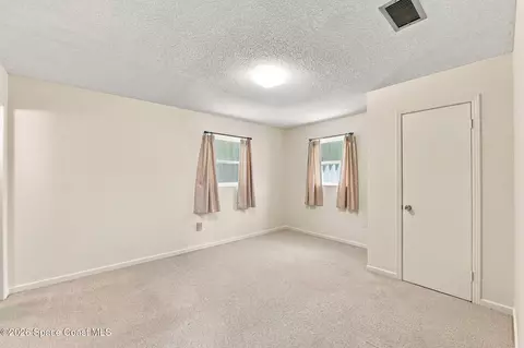 Bedroom - 1861 Dawn Dr, Melbourne, FL 32935 photo 8 of 9