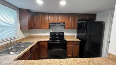Kitchen - 588 N Wickham Rd #51, Melbourne, FL 32935 photo 1 of 2