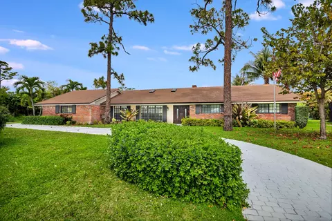 320 N Country Club Dr, Atlantis, FL 33462