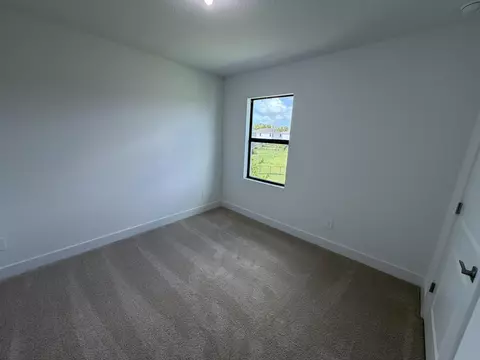 Bedroom - 6781 SE Park Trace Dr, Stuart, FL 34997 photo 2 of 4