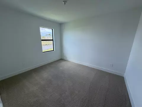 Bedroom - 6781 SE Park Trace Dr, Stuart, FL 34997 photo 3 of 4
