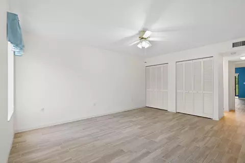 Bedroom - 5373 SE Miles Grant Rd #C-105, Stuart, FL 34997 photo 3 of 6