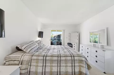 Bedroom - 6519 Chasewood Dr #E, Jupiter, FL 33458 photo 2 of 3