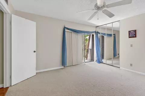 Bedroom - 5706 SE Riverboat Dr #202, Stuart, FL 34997 photo 4 of 5