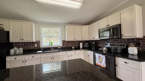 Kitchen - 5820 E Tangerine Ln, Okeechobee, FL 34972 photo 1 of 3