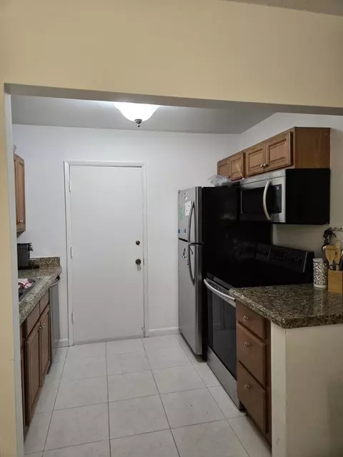 Kitchen - 101 E Mcnab Rd #217, Pompano Beach, FL 33060 photo 2 of 3