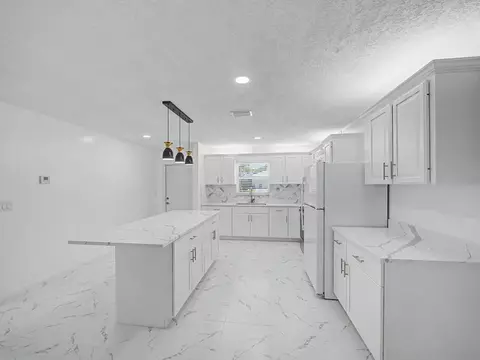 Kitchen - 3961 SE Dixie Ross St, Stuart, FL 34997 photo 2 of 5