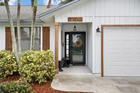 Exterior - 6702 SE Raintree Ave, Stuart, FL 34997 photo 4 of 13