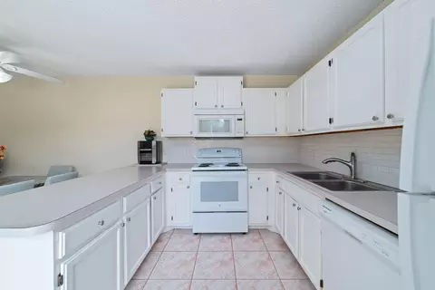 Kitchen - 5793 SE Windsong Ln, Stuart, FL 34997 photo 2 of 4