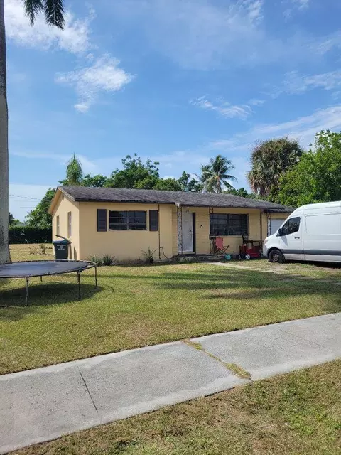 730 W Ilex Dr, Lake Park, FL 33403