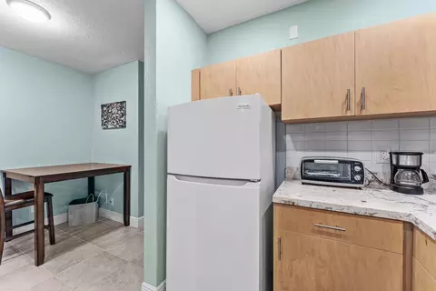 Kitchen - 301 E Mcnab Rd #113, Pompano Beach, FL 33060 photo 2 of 3