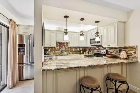 7 Atrium Cir #D, Atlantis, FL 33462