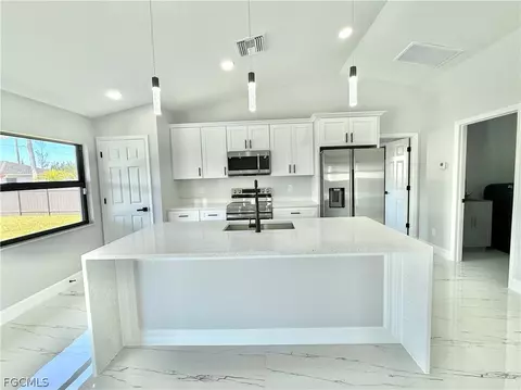 Kitchen - 1016 NW 24th Ave, Cape Coral, FL 33993 photo 1 of 2