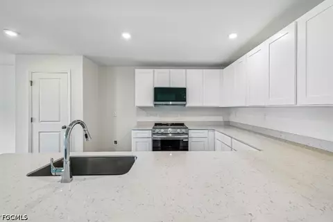 Kitchen - 831 Lamar St E, Lehigh Acres, FL 33974 photo 1 of 2