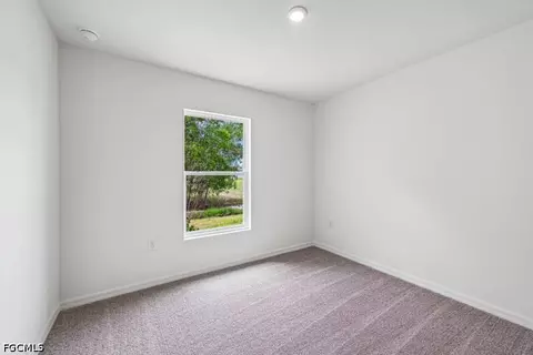 Bedroom - 831 Lamar St E, Lehigh Acres, FL 33974 photo 2 of 5