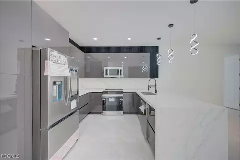 Kitchen - 809 Williams Ave, Lehigh Acres, FL 33972 photo 3 of 4