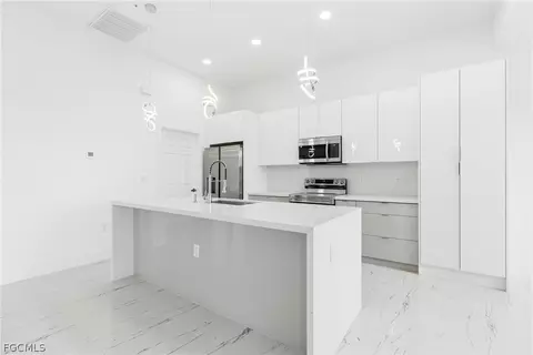 Kitchen - 321 Peerless St, Lehigh Acres, FL 33974 photo 6 of 7