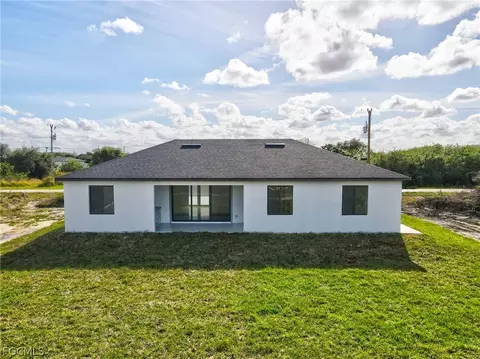 Exterior - 321 Peerless St, Lehigh Acres, FL 33974 photo 5 of 9