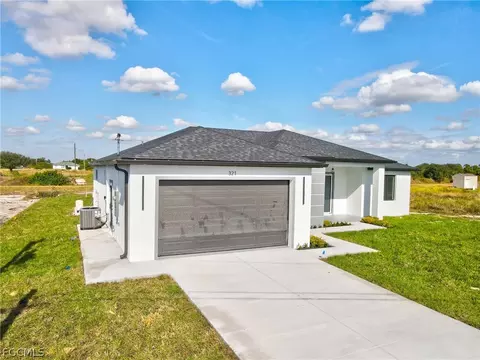 Exterior - 321 Peerless St, Lehigh Acres, FL 33974 photo 7 of 9