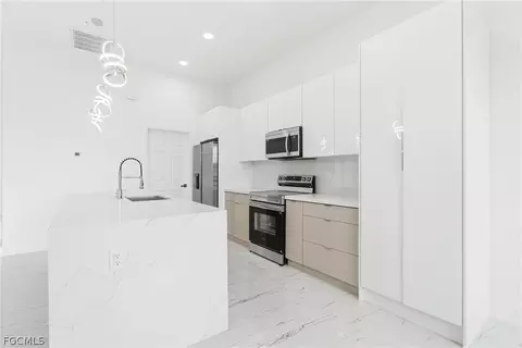 Kitchen - 321 Peerless St, Lehigh Acres, FL 33974 photo 5 of 7