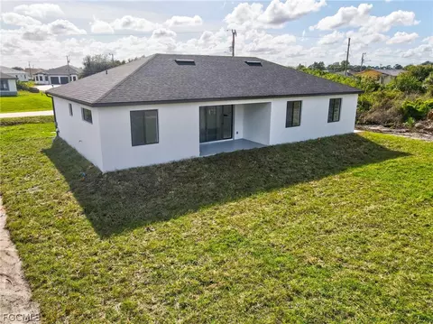 Exterior - 321 Peerless St, Lehigh Acres, FL 33974 photo 6 of 9