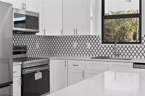 Kitchen - 205 E 15th St, Lehigh Acres, FL 33972 photo 5 of 6