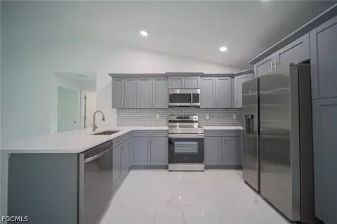 Kitchen - 824 Carpenter St E, Lehigh Acres, FL 33974 photo 3 of 3