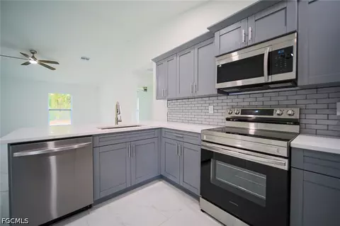 Kitchen - 824 Carpenter St E, Lehigh Acres, FL 33974 photo 2 of 3