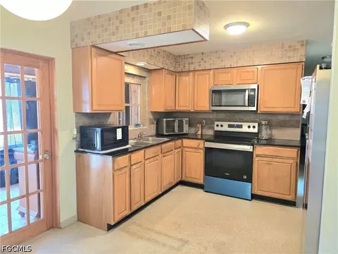 Kitchen - 4357 23rd Ave SW, Naples, FL 34116 photo 1 of 2
