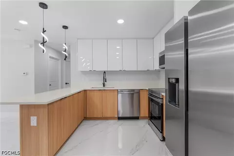 Kitchen - 940 Berg St E, Lehigh Acres, FL 33974 photo 2 of 2