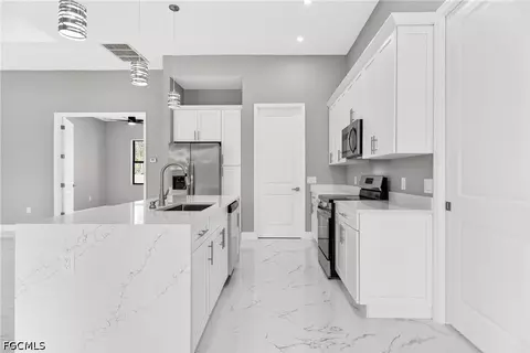 Kitchen - 1114 Bari St E, Lehigh Acres, FL 33974 photo 7 of 8
