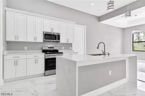 Kitchen - 1114 Bari St E, Lehigh Acres, FL 33974 photo 5 of 8