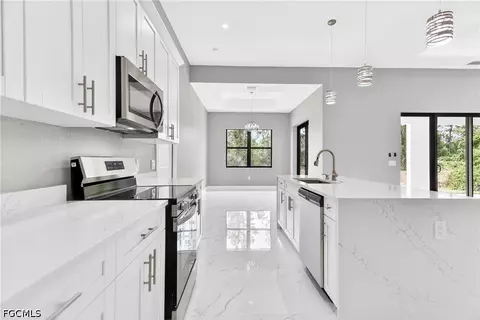 Kitchen - 1114 Bari St E, Lehigh Acres, FL 33974 photo 4 of 8
