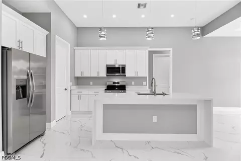 Kitchen - 1114 Bari St E, Lehigh Acres, FL 33974 photo 3 of 8