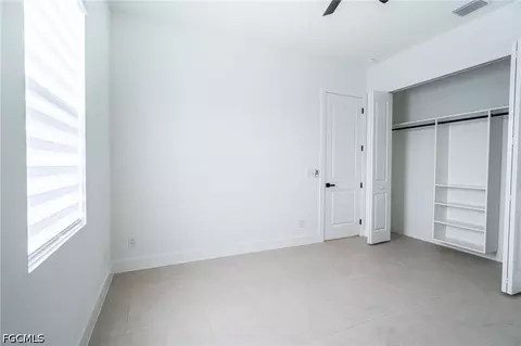Bedroom - 1142 Eclipse St E, Lehigh Acres, FL 33974 photo 6 of 11