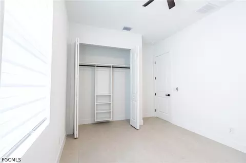 Bedroom - 1142 Eclipse St E, Lehigh Acres, FL 33974 photo 9 of 11