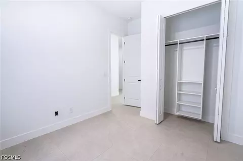 Bedroom - 1142 Eclipse St E, Lehigh Acres, FL 33974 photo 3 of 11