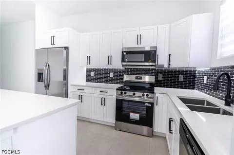 Kitchen - 1142 Eclipse St E, Lehigh Acres, FL 33974 photo 1 of 5