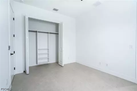 Bedroom - 1142 Eclipse St E, Lehigh Acres, FL 33974 photo 5 of 11