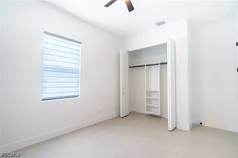 Bedroom - 1142 Eclipse St E, Lehigh Acres, FL 33974 photo 8 of 11